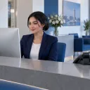 ALLSAFE SOLUTIONS team meeting around a laptop