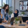 ALLSAFE SOLUTIONS team meeting around a laptop